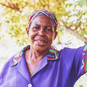 Africa, Simplicity, Woman - An African Woman Standing at an outdoor location, looking at the Camera for a Portrait